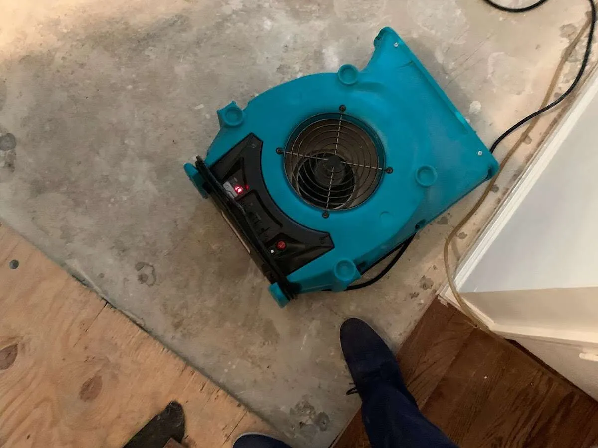 Air mover drying subfloor during Leak Detection & Repair in Apex
